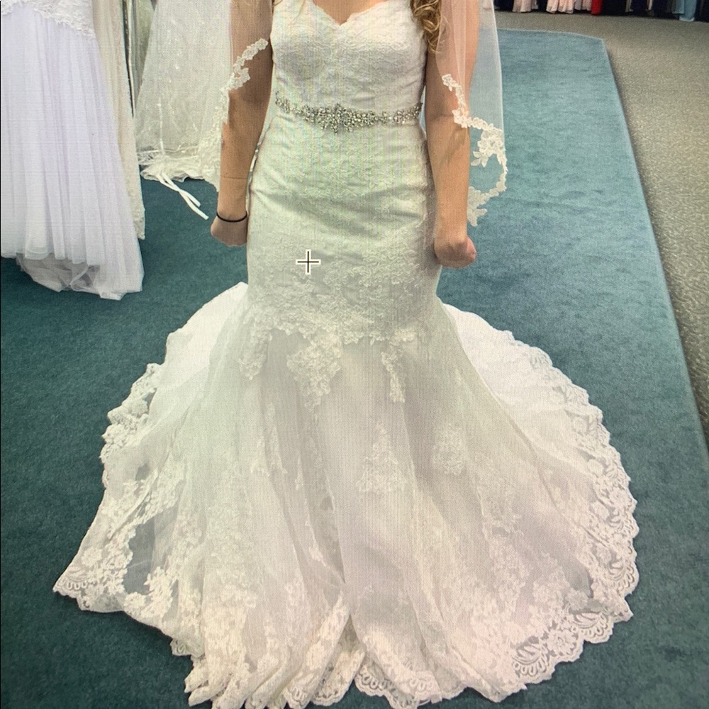 Never worn wedding dress, veil and tiara included